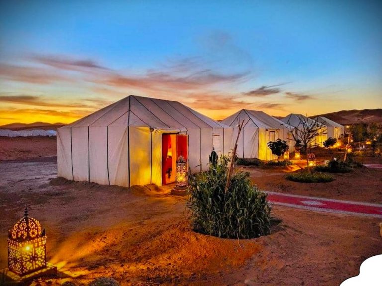 Luxury desert camps in Morocco offering stunning views of the Sahara dunes and Berber tents under the stars.