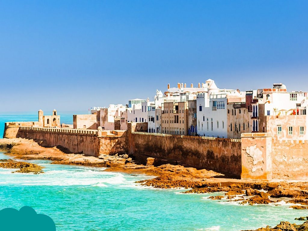Solo traveler walking along Essaouira beach at sunset – Solo Travel Morocco