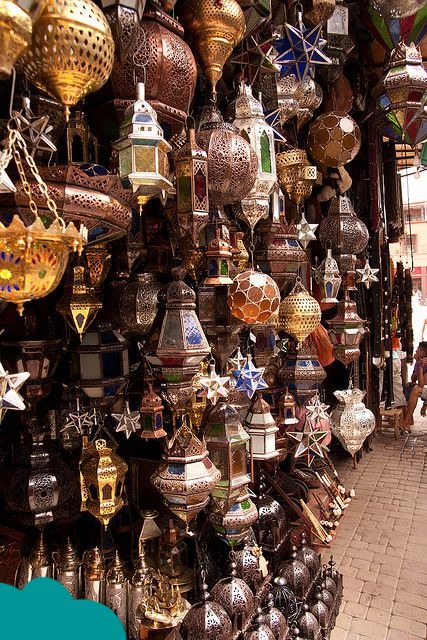 How to Negotiate in Marrakech Souks: selecting colorful Moroccan lanterns in the market