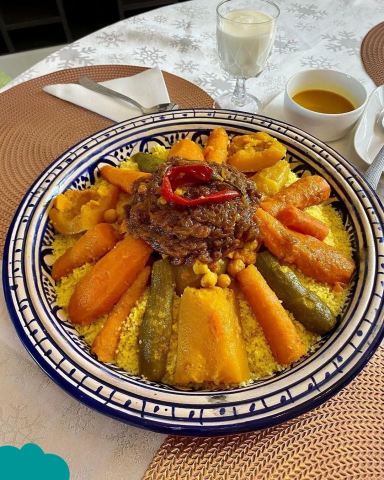 Moroccan Cuisine Must-Try Foods couscous with lamb and seven vegetables in a traditional Moroccan dish