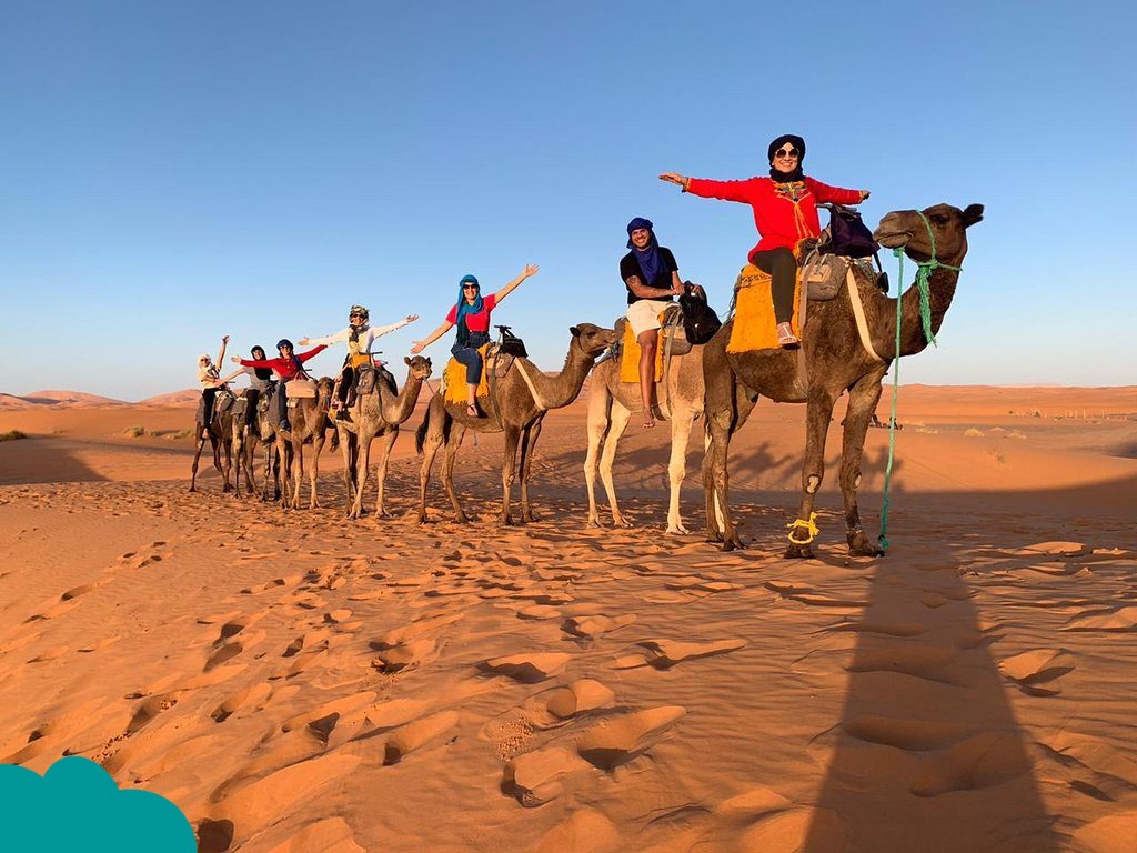 Traveler wearing appropriate Morocco travel outfits in the Sahara Desert