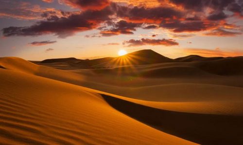 watching the sunset in the desert of Merzouuga